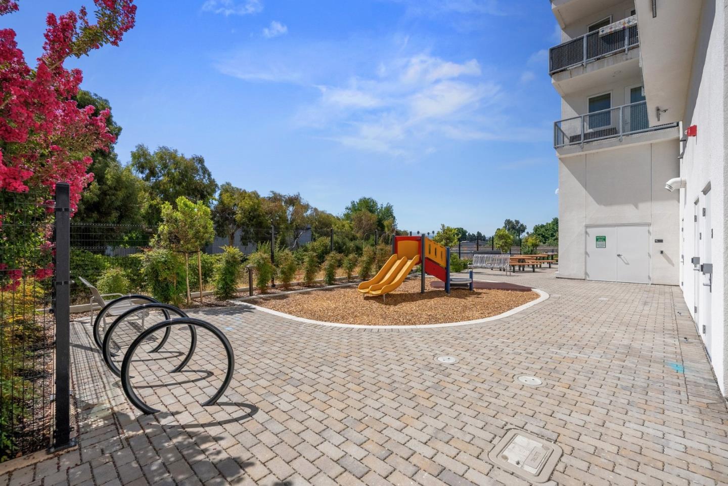 42111 Osgood Road, Unit 215 Fremont, CA 94539 - Photo 32 of 44 a view of a swimming pool with a patio