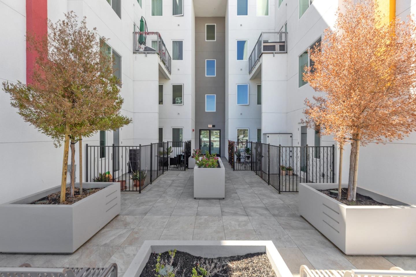 42111 Osgood Road, Unit 215 Fremont, CA 94539 - Photo 34 of 44 a view of a patio with couches and a potted plant