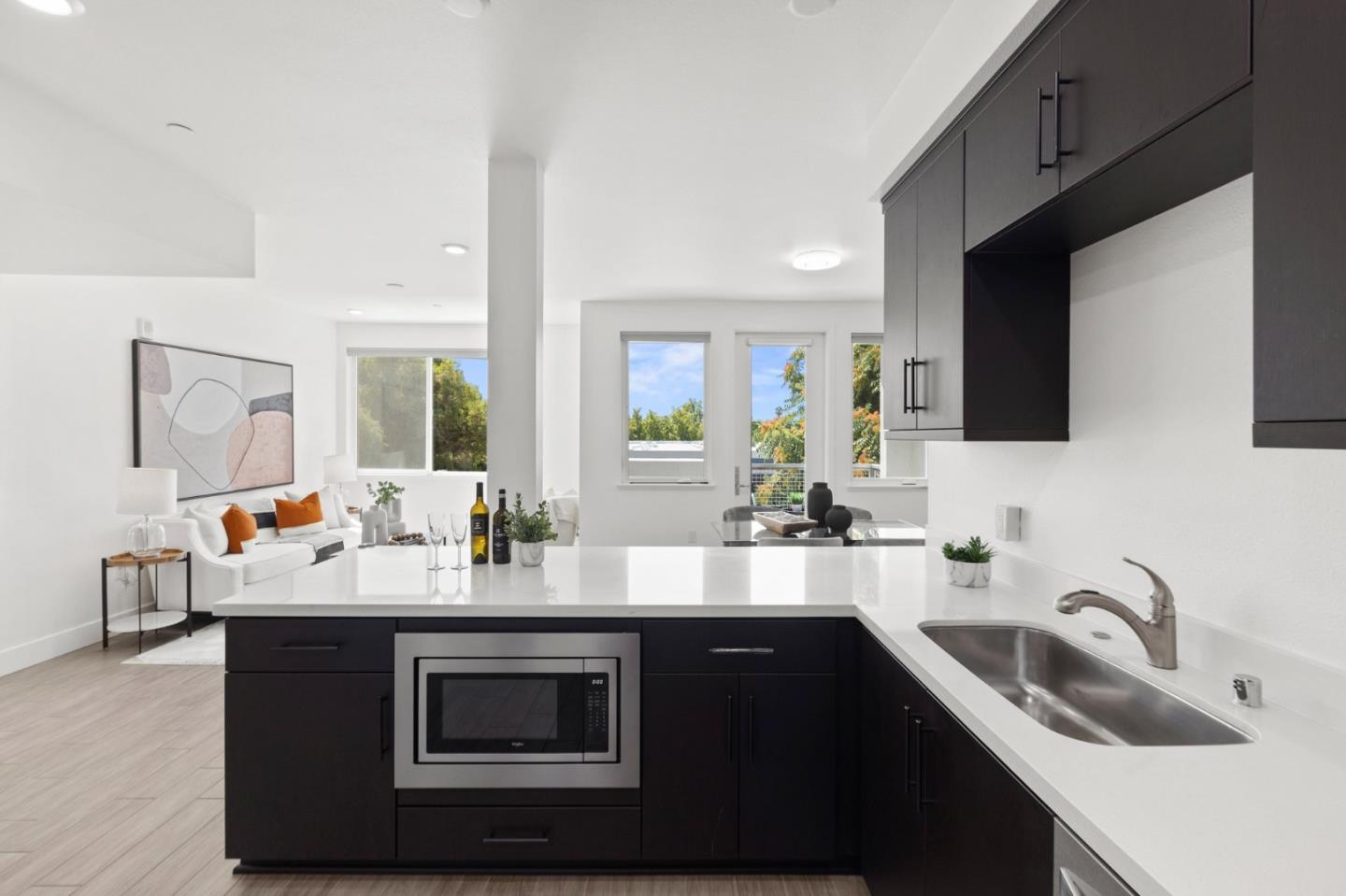 42111 Osgood Road, Unit 215 Fremont, CA 94539 - Photo 5 of 44 a kitchen with sink a microwave and cabinets