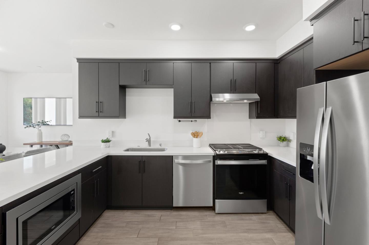 42111 Osgood Road, Unit 215 Fremont, CA 94539 - Photo 7 of 44 a kitchen with a sink a stove and refrigerator