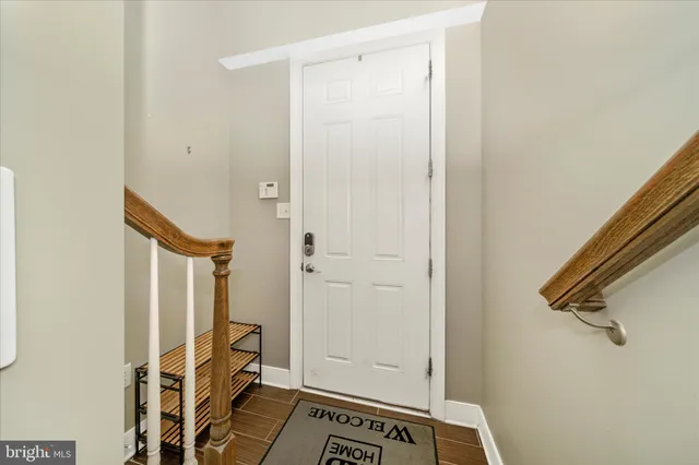 a view of an entryway with wooden floor