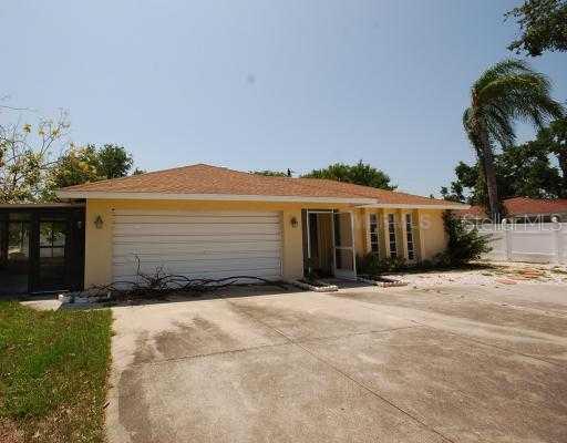6336 South Lockwood Ridge Road Sarasota, FL 34231 - Photo 1 of 1 a view of a house with a yard