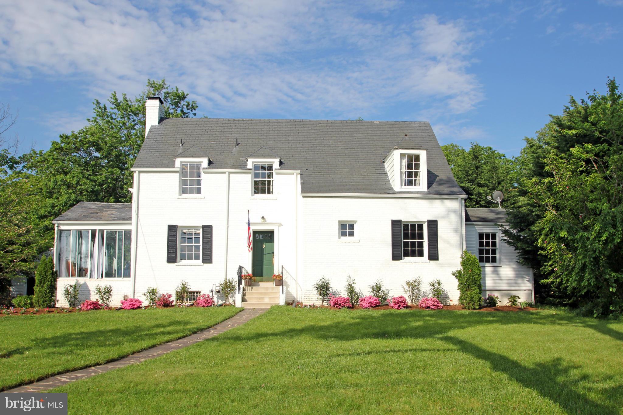 10314 Naglee Road Silver Spring, MD 20903 - Photo 1 of 30 a front view of a house with a garden