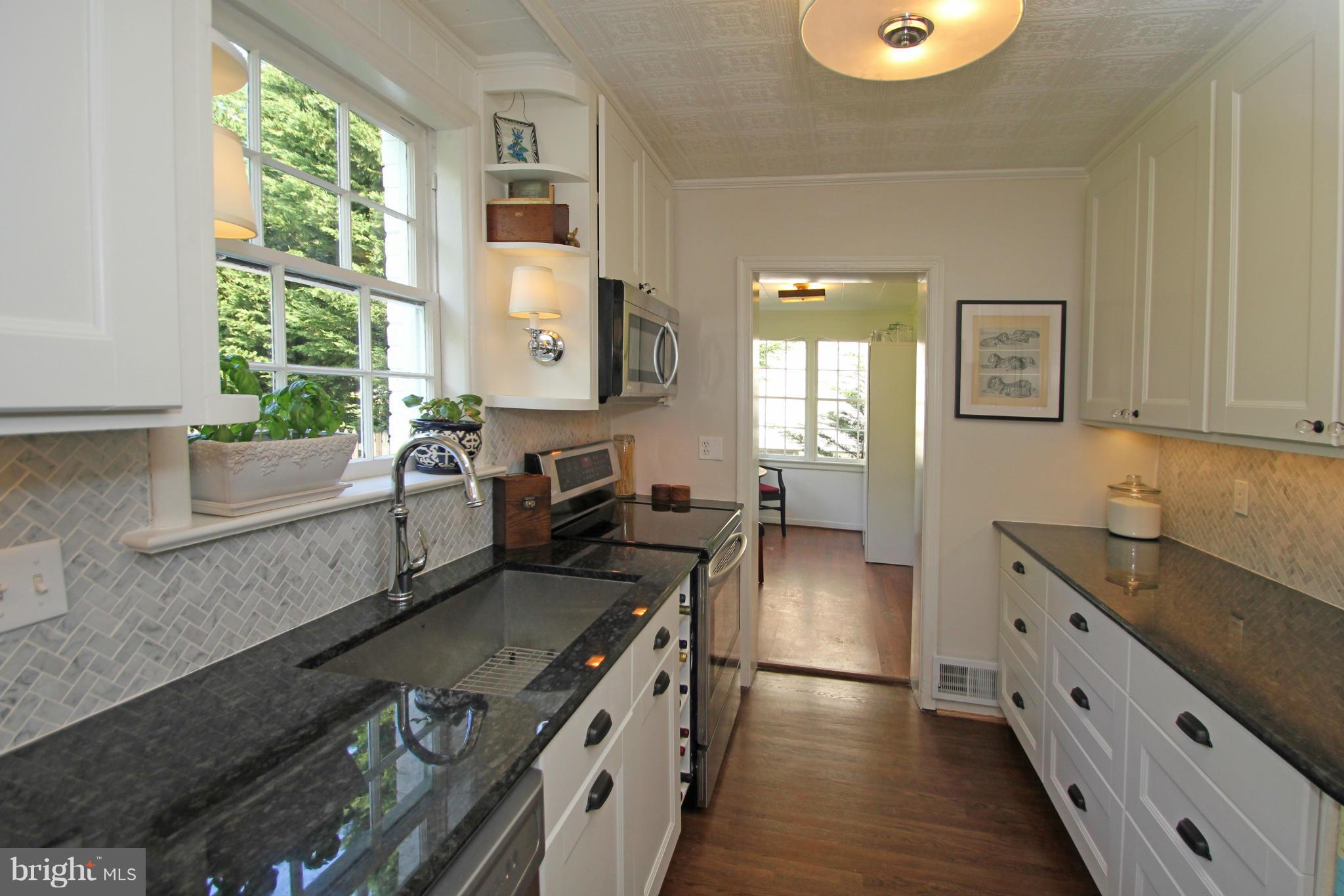 10314 Naglee Road Silver Spring, MD 20903 - Photo 11 of 30 a kitchen with a stove and a sink