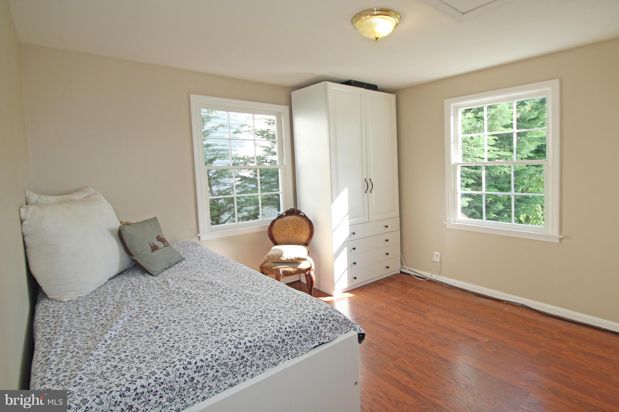 10314 Naglee Road Silver Spring, MD 20903 - Photo 13 of 30 a bedroom with a bed and window