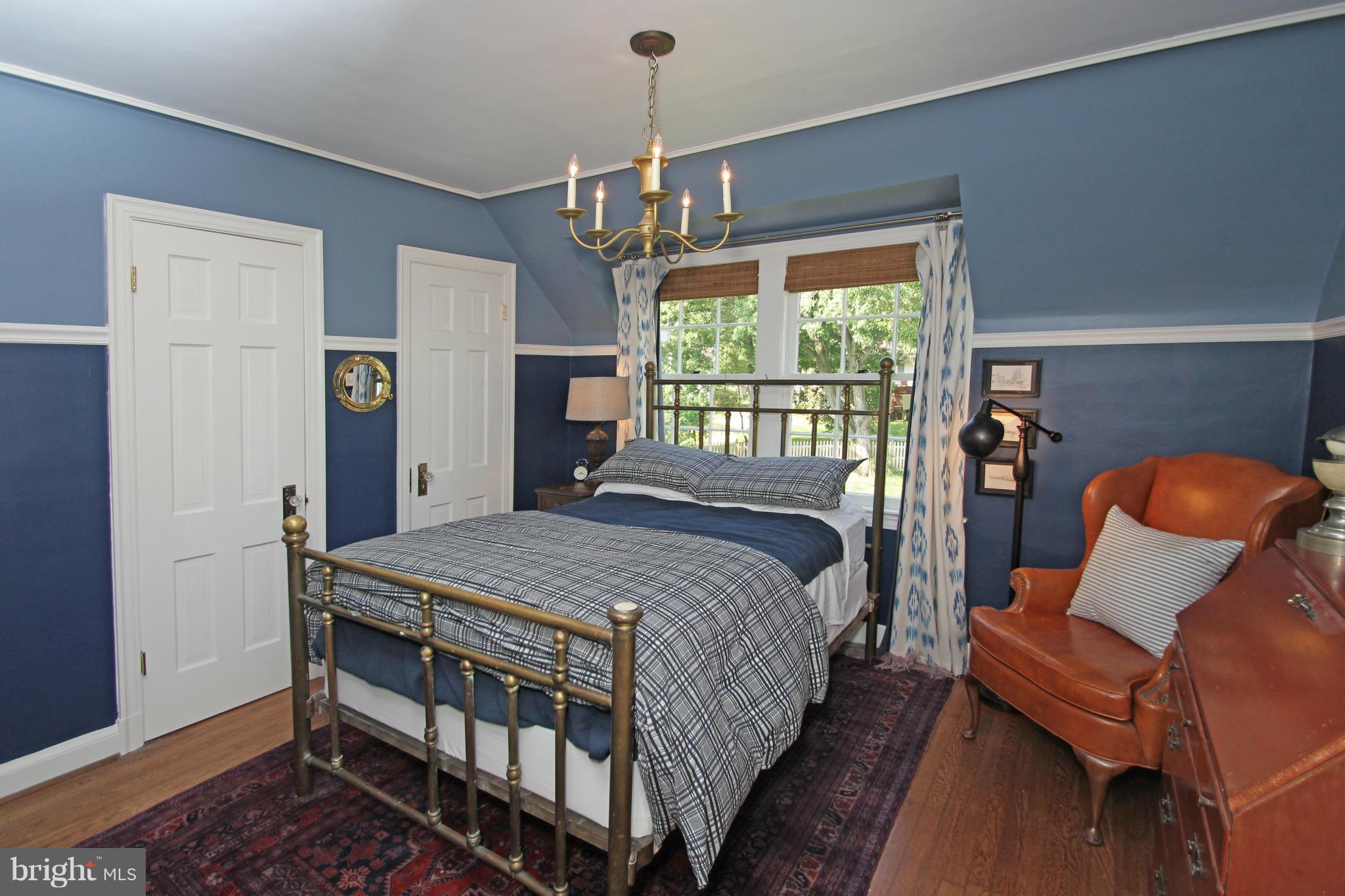 10314 Naglee Road Silver Spring, MD 20903 - Photo 20 of 30 a bedroom with bed and windows