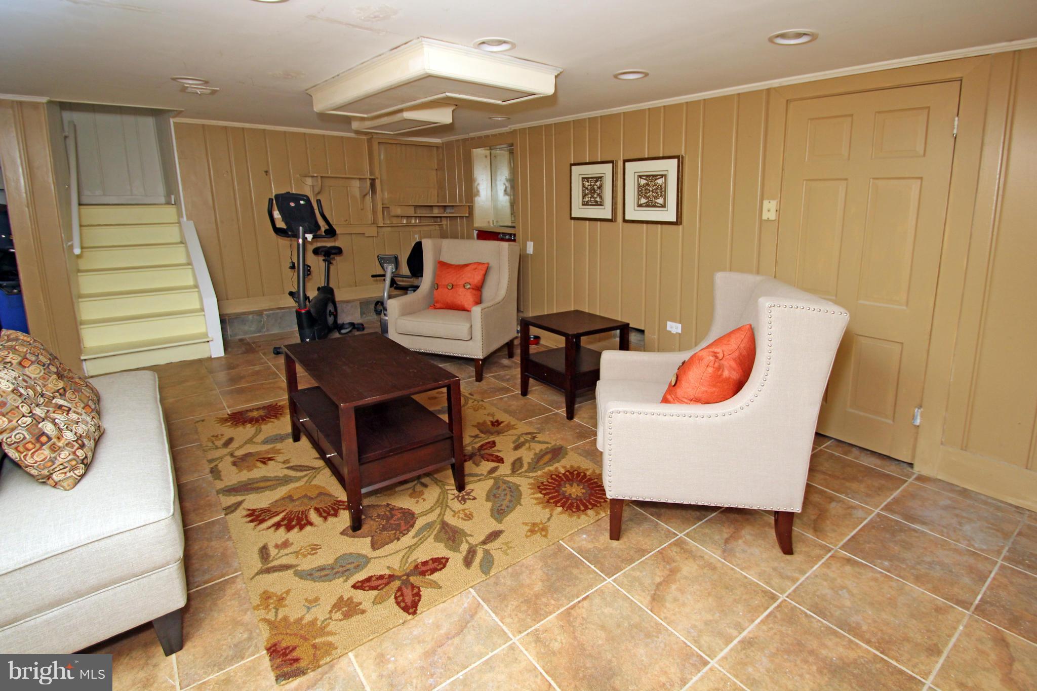 10314 Naglee Road Silver Spring, MD 20903 - Photo 24 of 30 a living room with patio furniture and a wooden floor