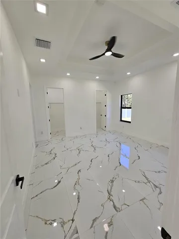 a very nice looking room with a ceiling fan