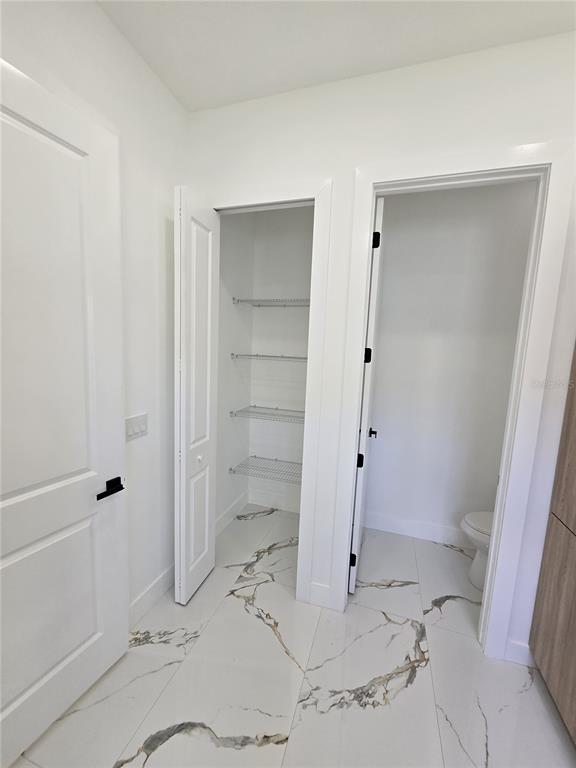 5823 Whippoorwill Drive Tampa, FL 33625 - Photo 16 of 31 a bathroom with a sink and a shower