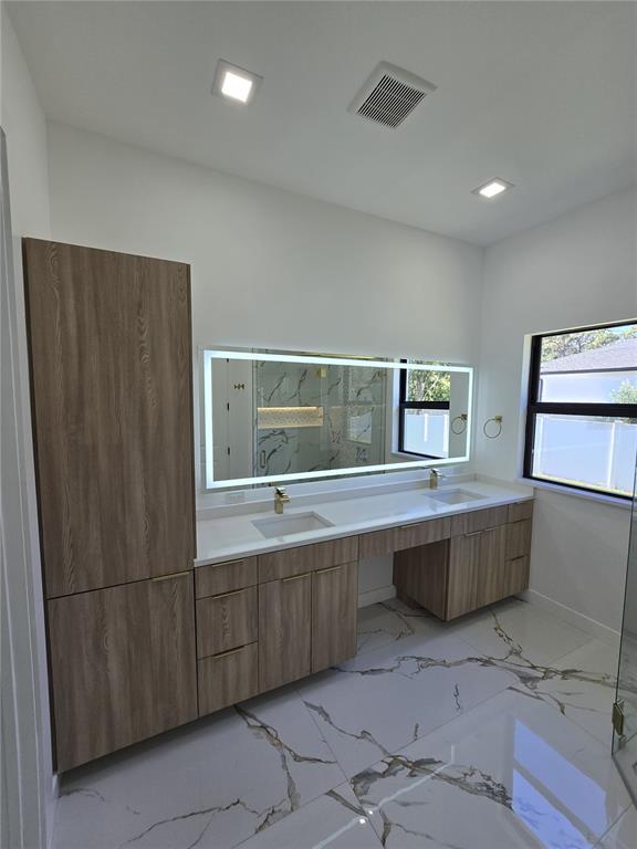 5823 Whippoorwill Drive Tampa, FL 33625 - Photo 21 of 31 a room with cabinets and window