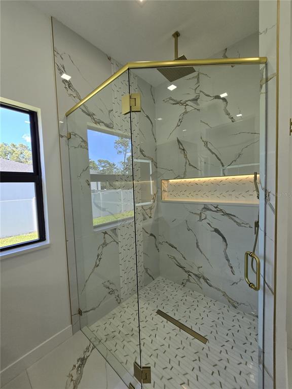 5823 Whippoorwill Drive Tampa, FL 33625 - Photo 22 of 31 a bathroom with a shower