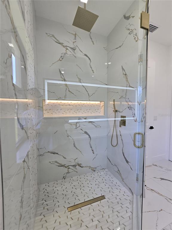 5823 Whippoorwill Drive Tampa, FL 33625 - Photo 23 of 31 a bathroom with a shower