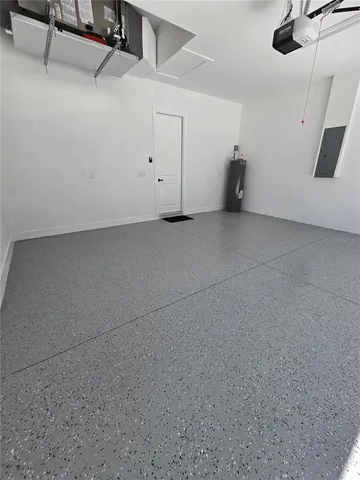 a view of a kitchen with a sink and cabinets