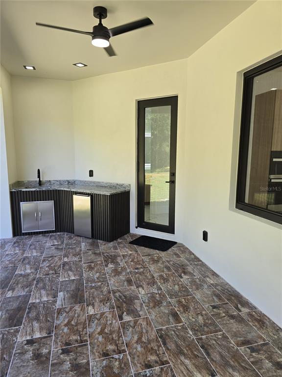 5823 Whippoorwill Drive Tampa, FL 33625 - Photo 28 of 31 a view of a kitchen with a sink and cabinets