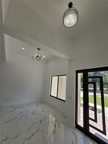 a view of a room with window and air conditioner