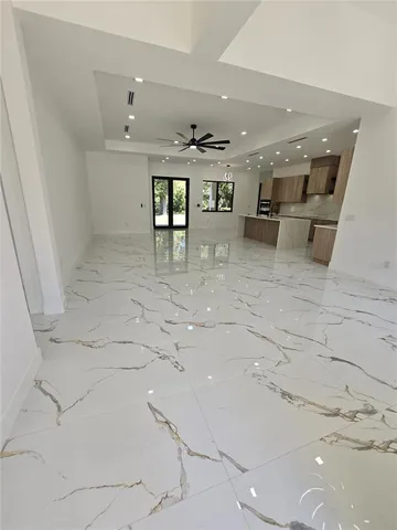 a view of a hallway with seating space