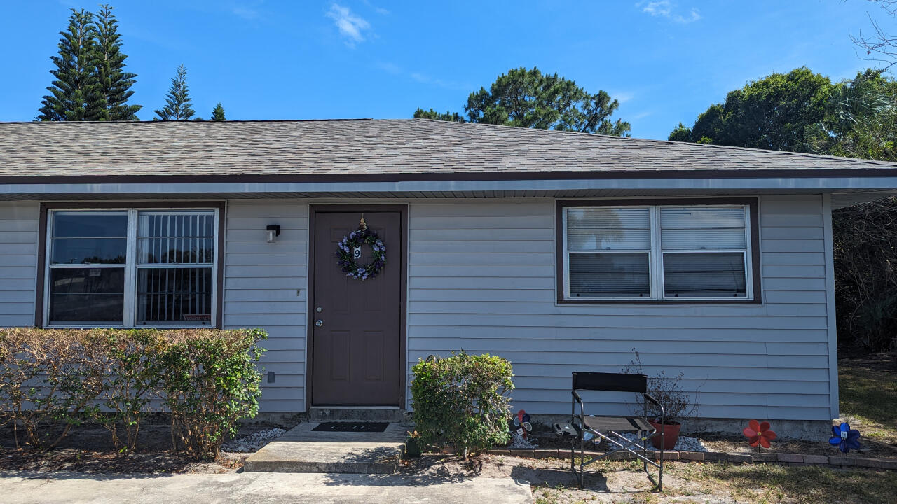 809 East Weatherbee Road Fort Pierce, FL 34982 - Photo 4 of 12 a view of a stone house with potted plants