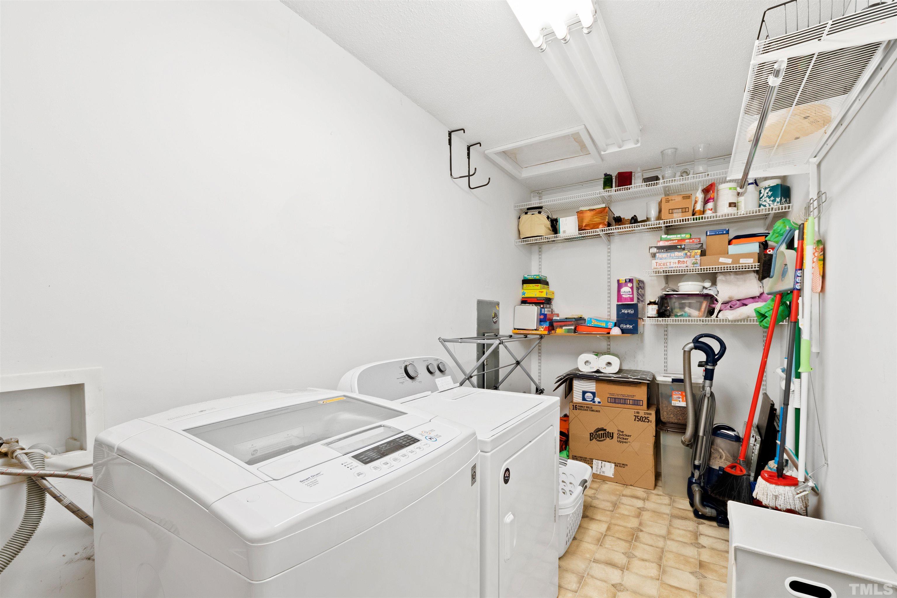 2704 Westhampton Place Raleigh, NC 27604 - Photo 27 of 47 a utility room with dryer and washer