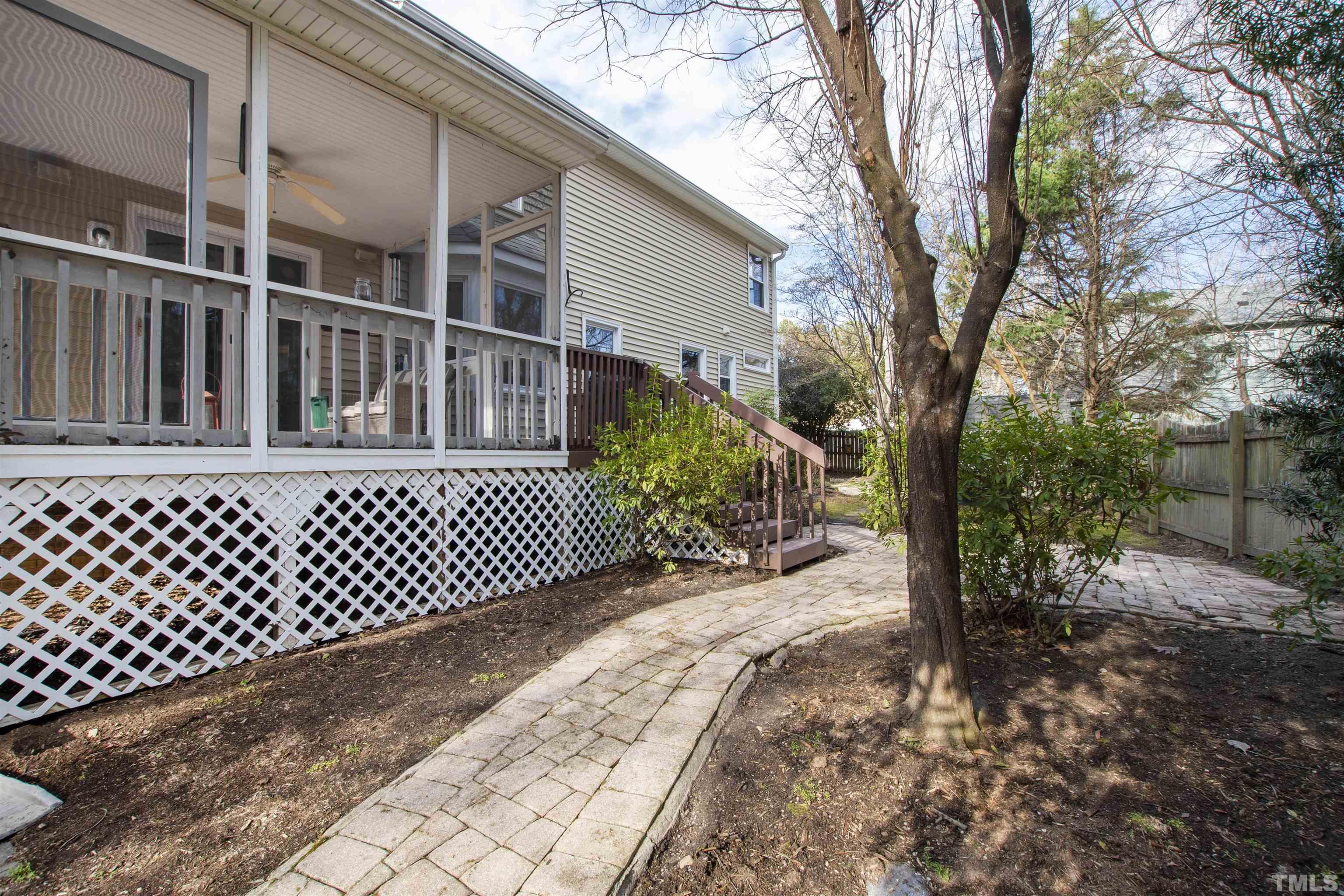2704 Westhampton Place Raleigh, NC 27604 - Photo 42 of 47 a porch with a bench next to a yard