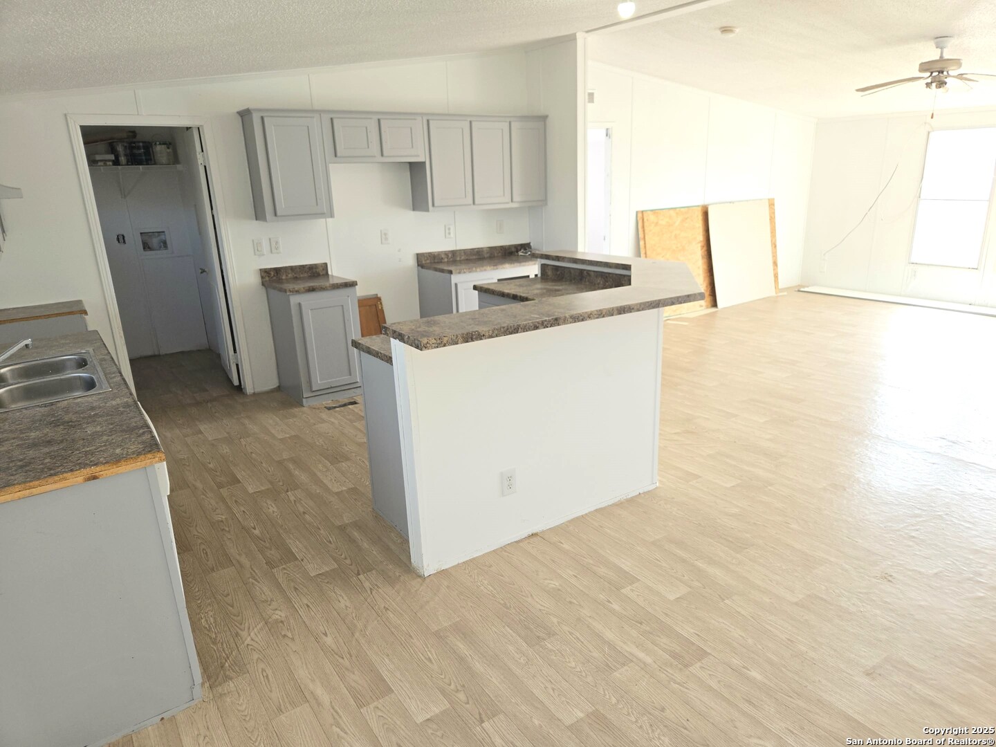 4124 Farmview Loop Converse, TX 78109 - Photo 4 of 19 a kitchen with stainless steel appliances granite countertop a sink stove and refrigerator