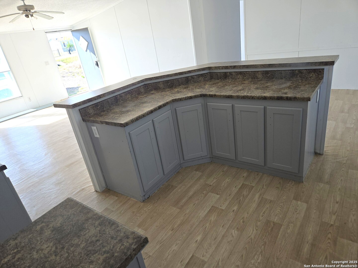 4124 Farmview Loop Converse, TX 78109 - Photo 6 of 19 a kitchen with granite countertop a sink and a stove
