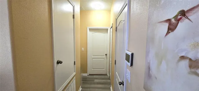 a view of a bathroom from the hallway