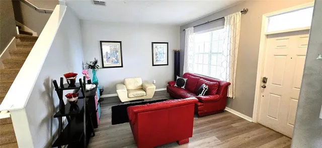 a living room with furniture and a window