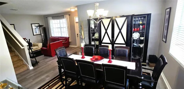 a view of a dining room with furniture and window