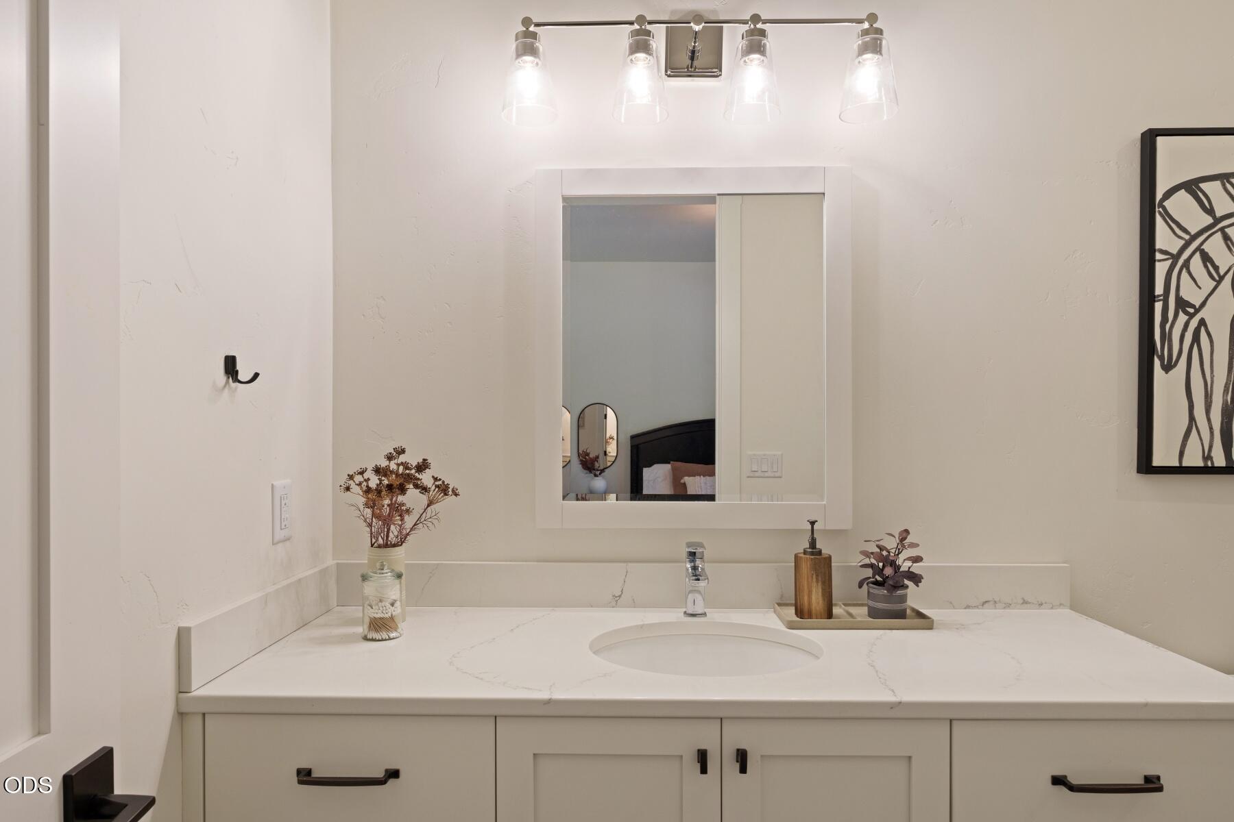60255 Sunset View Drive Bend, OR 97702 - Photo 31 of 48 a bathroom with a sink and a mirror