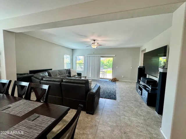 a living room with furniture window and flat screen tv