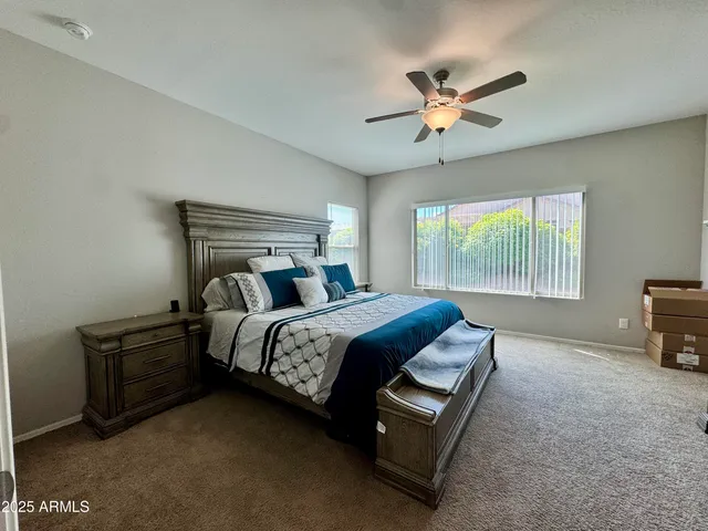 a bed room with a bed and a tv