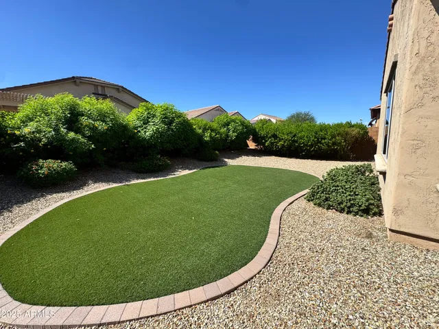a view of a swimming pool in a backyard