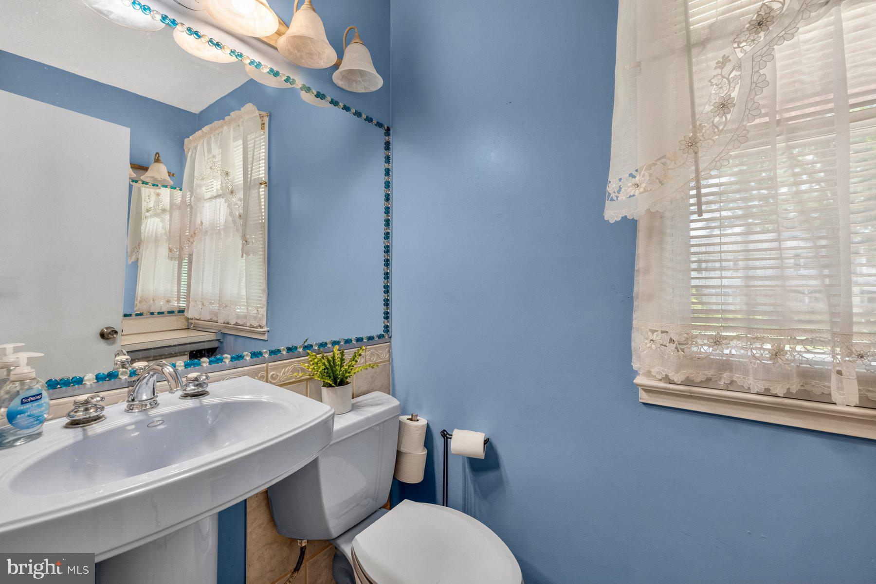 2311 Coleridge Drive Silver Spring, MD 20910 - Photo 15 of 47 Charming blue-hued bathroom retreat.