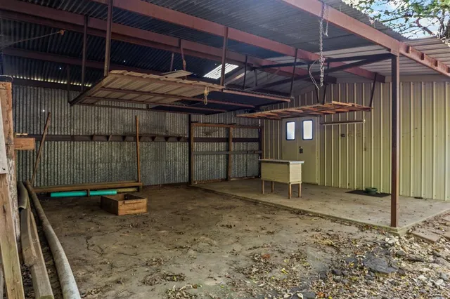 a view of a room with wooden walls