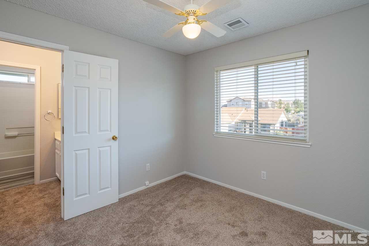 5217 Simons Drive Reno, NV 89523 - Photo 14 of 18 a view of an empty room with a window