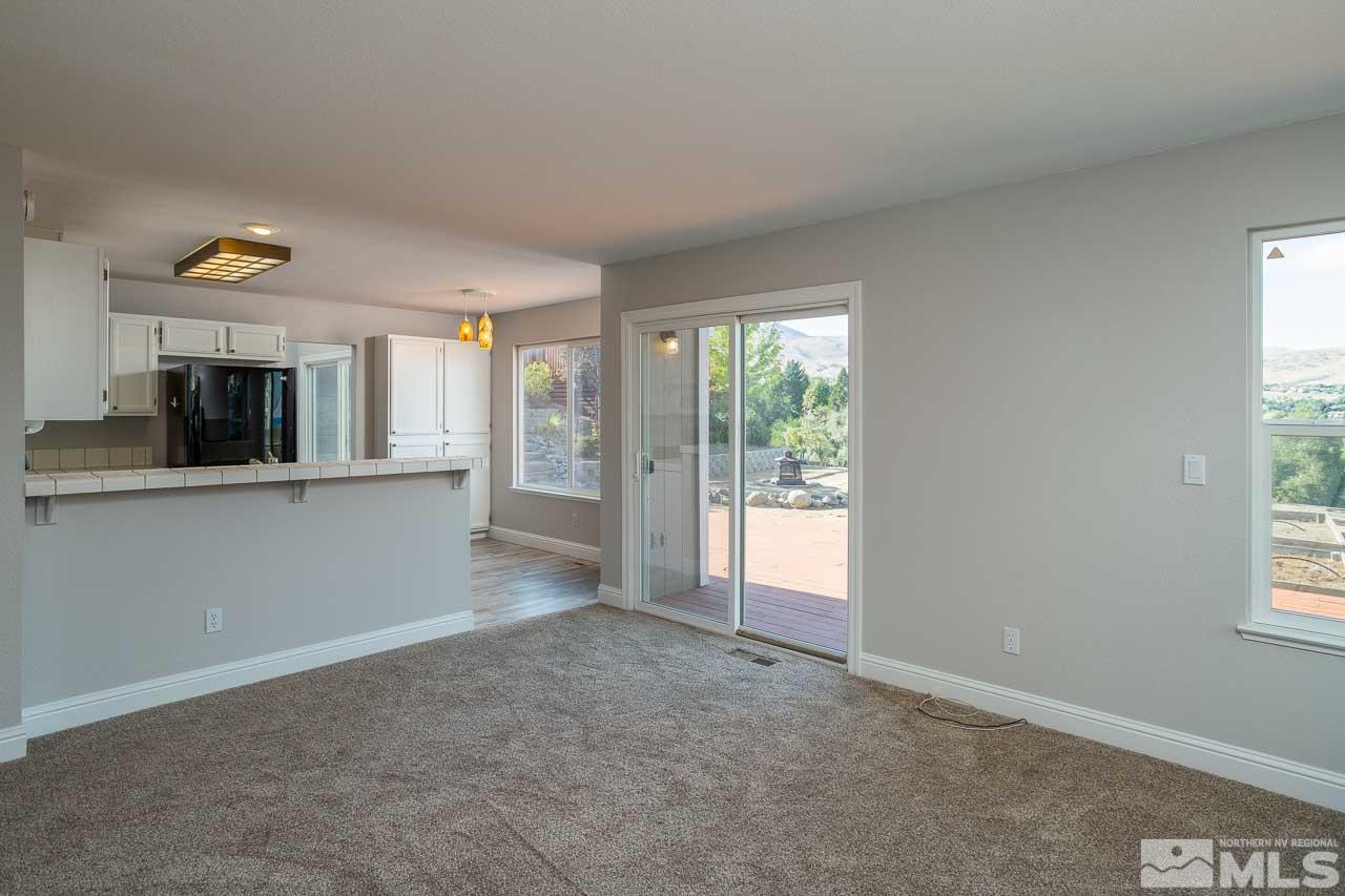 5217 Simons Drive Reno, NV 89523 - Photo 4 of 18 a view of a kitchen and a windows in an empty room