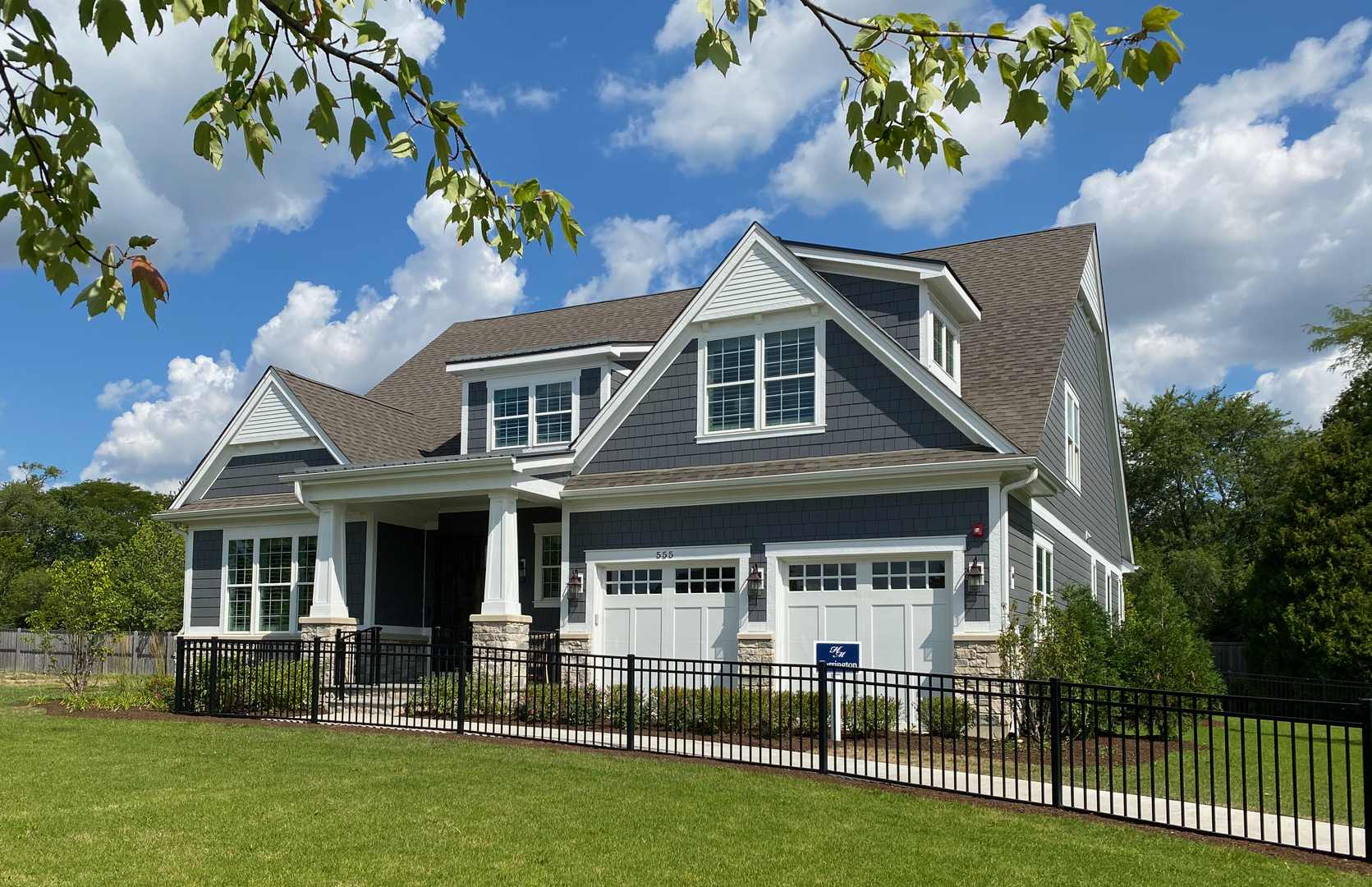 front view of a house with a yard