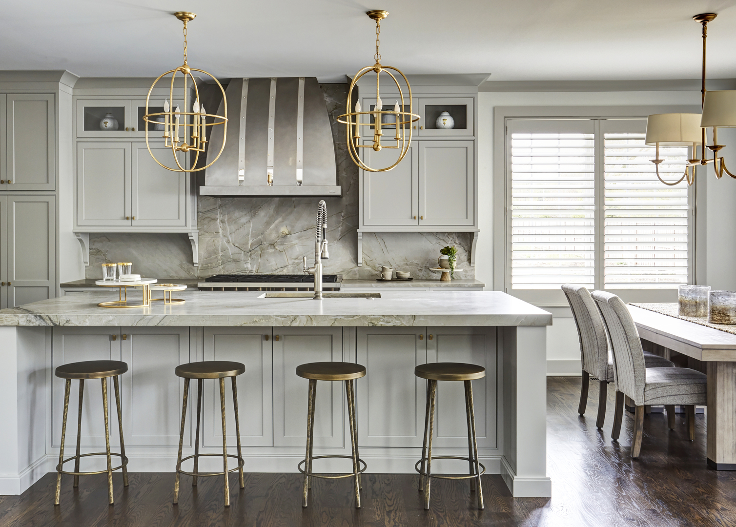 5591 Barton Lane Hinsdale, IL 60521 - Photo 5 of 24 a kitchen with stainless steel appliances granite countertop a dining table chairs and white cabinets