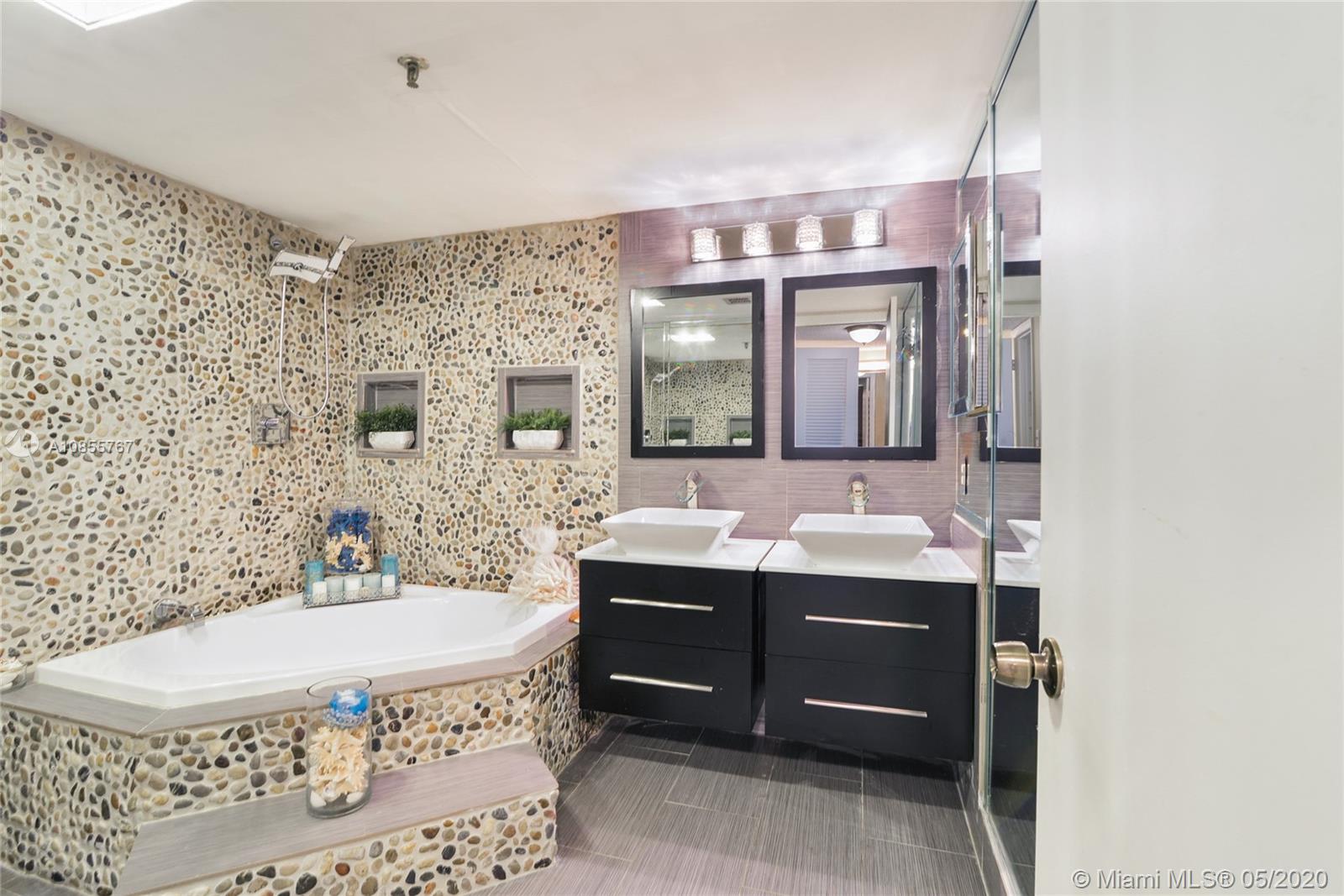 900 Northeast 195th Street, Unit 610 Miami, FL 33179 - Photo 6 of 15 Renovated master bathroom