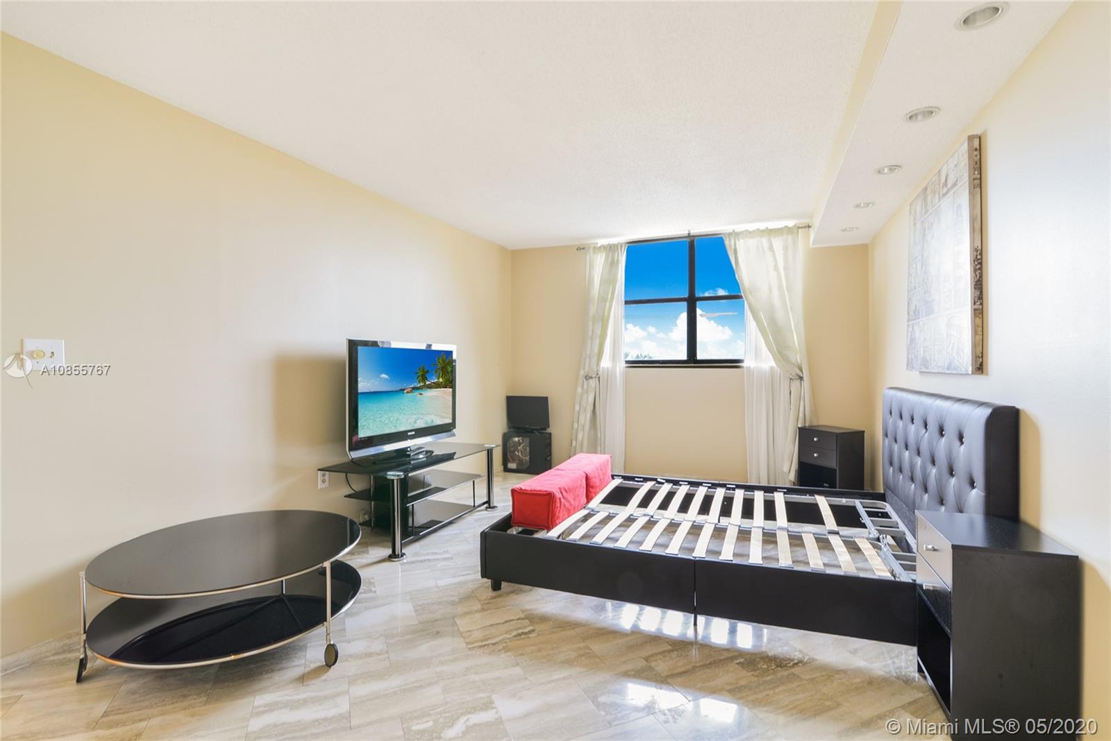 900 Northeast 195th Street, Unit 610 Miami, FL 33179 - Photo 8 of 15 Second bedroom with walking closet