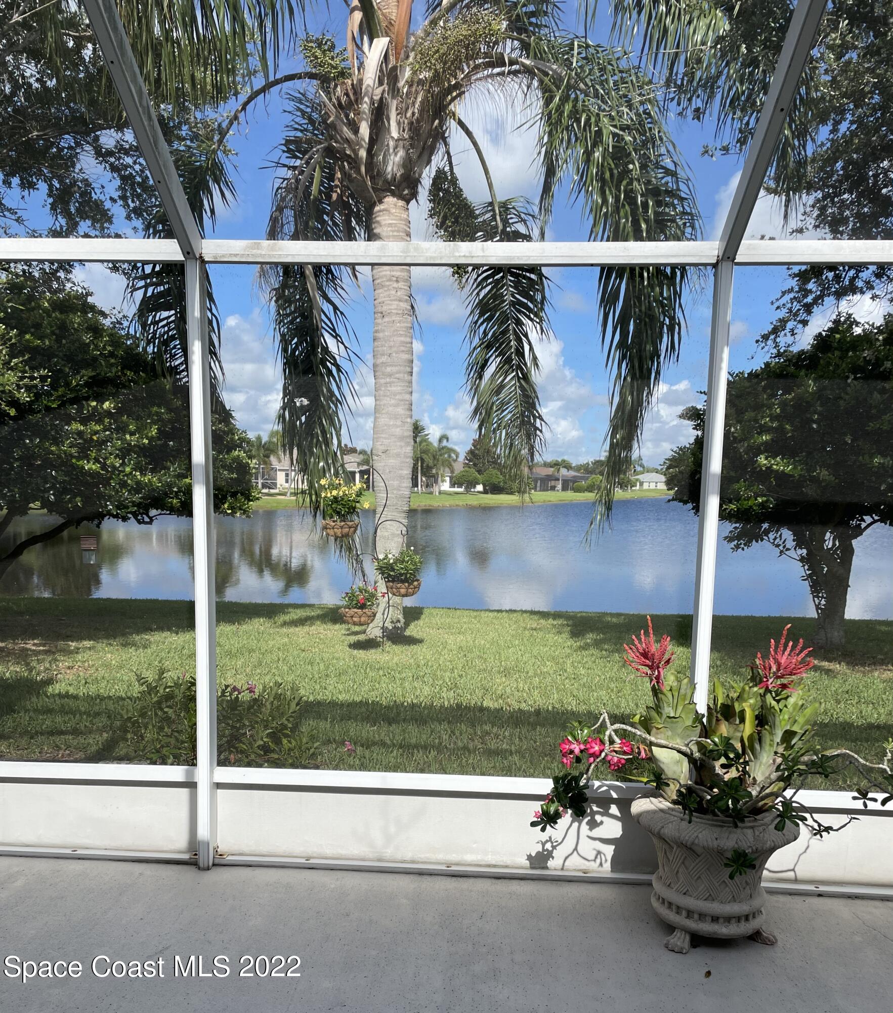 1063 Brumpton Place Rockledge, FL 32955 - Photo 23 of 33 a view of a house with a garden