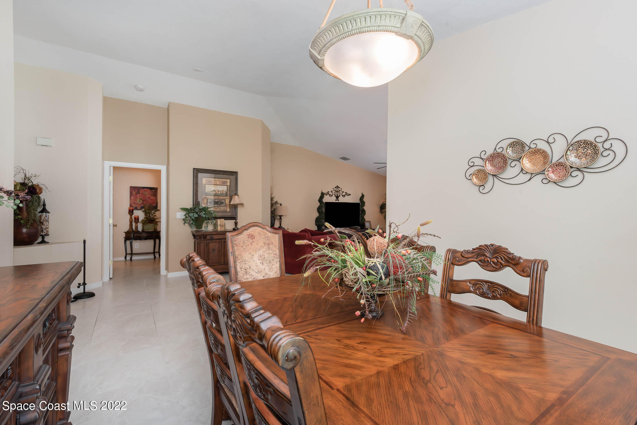 1063 Brumpton Place Rockledge, FL 32955 - Photo 8 of 33 a view of a dining room with furniture