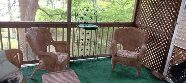 a view of a two chairs in the deck