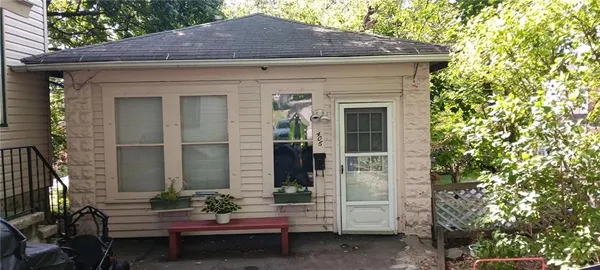 a backyard of a house with outdoor seating