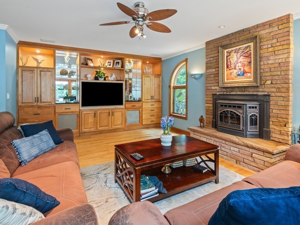 9 Santom Street Auburn, MA 01501 - Photo 10 of 42 a living room with furniture and a flat screen tv