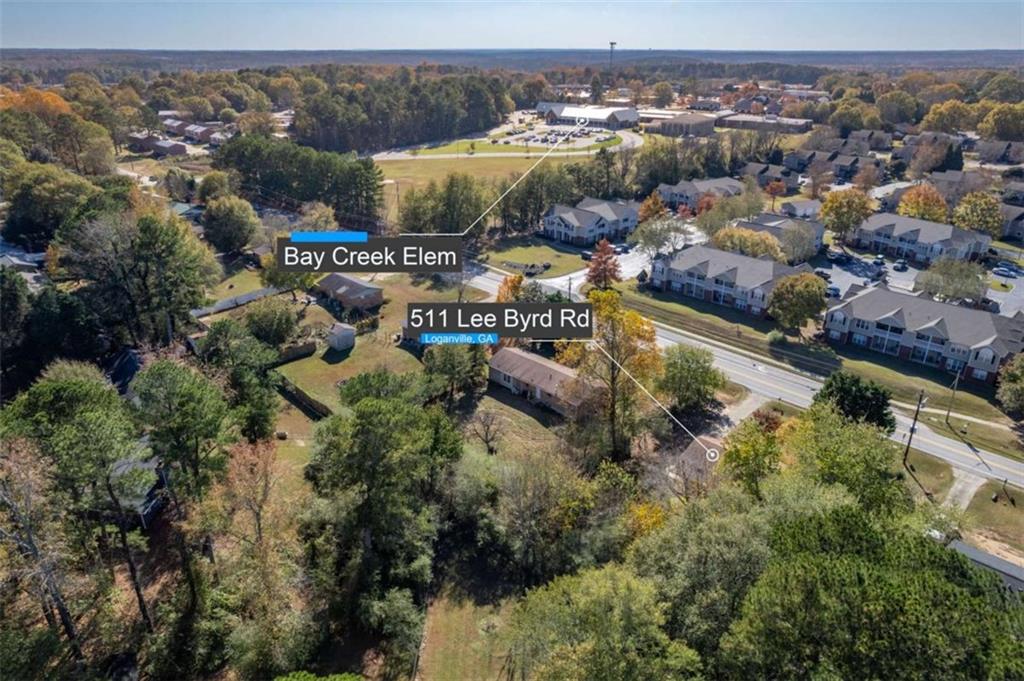 511 Lee Byrd Road Loganville, GA 30052 - Photo 2 of 32 an aerial view of residential houses with outdoor space