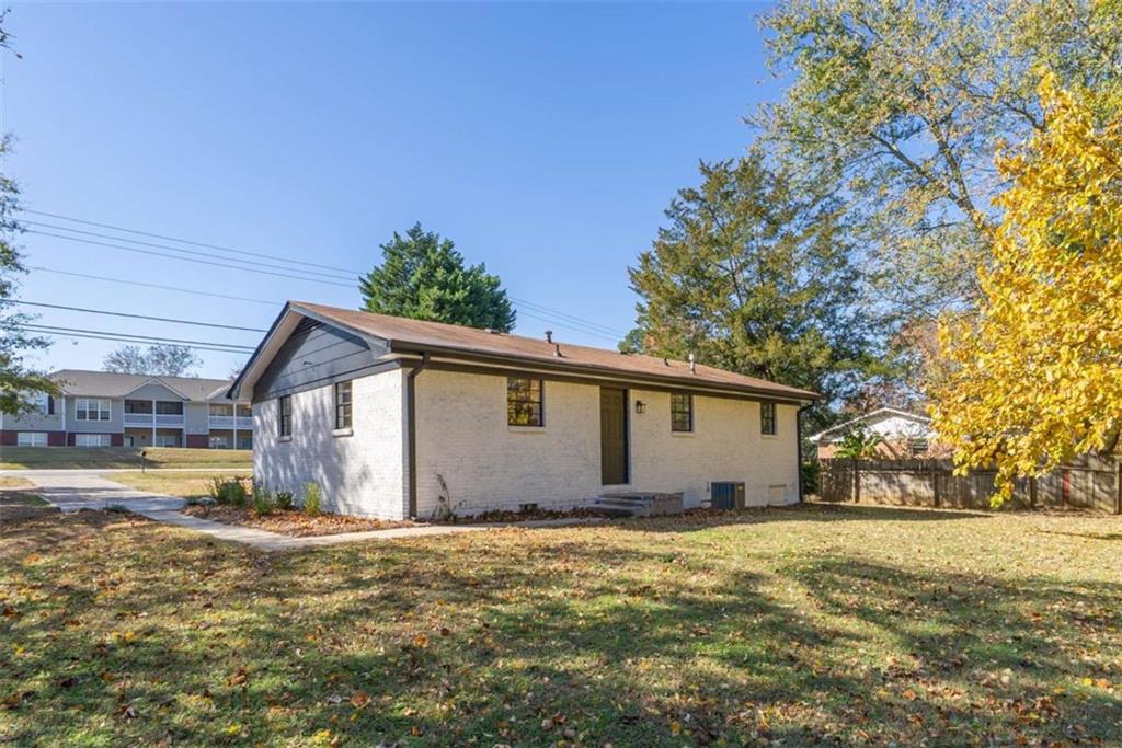 511 Lee Byrd Road Loganville, GA 30052 - Photo 26 of 32 a view of a house with a backyard