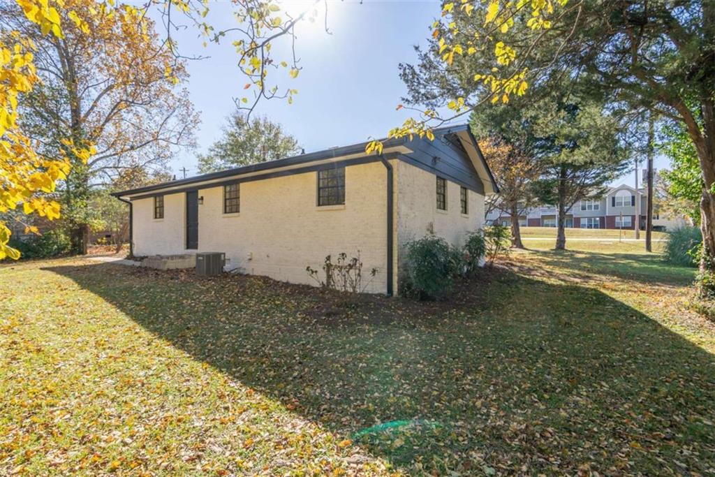 511 Lee Byrd Road Loganville, GA 30052 - Photo 28 of 32 a house that has a tree in front of it