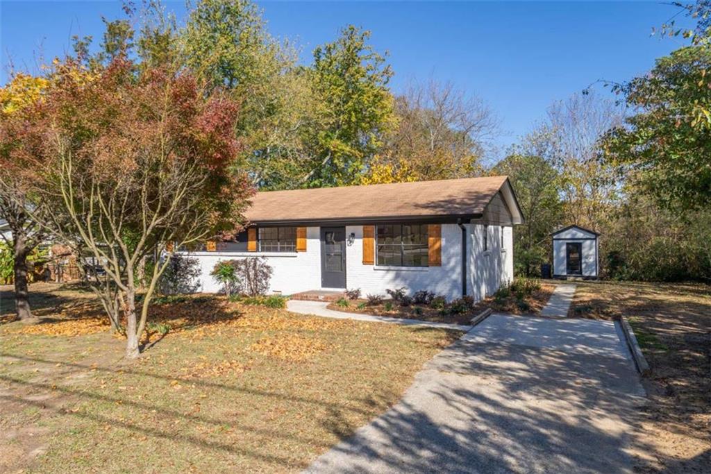 511 Lee Byrd Road Loganville, GA 30052 - Photo 3 of 32 a front view of a house with a yard