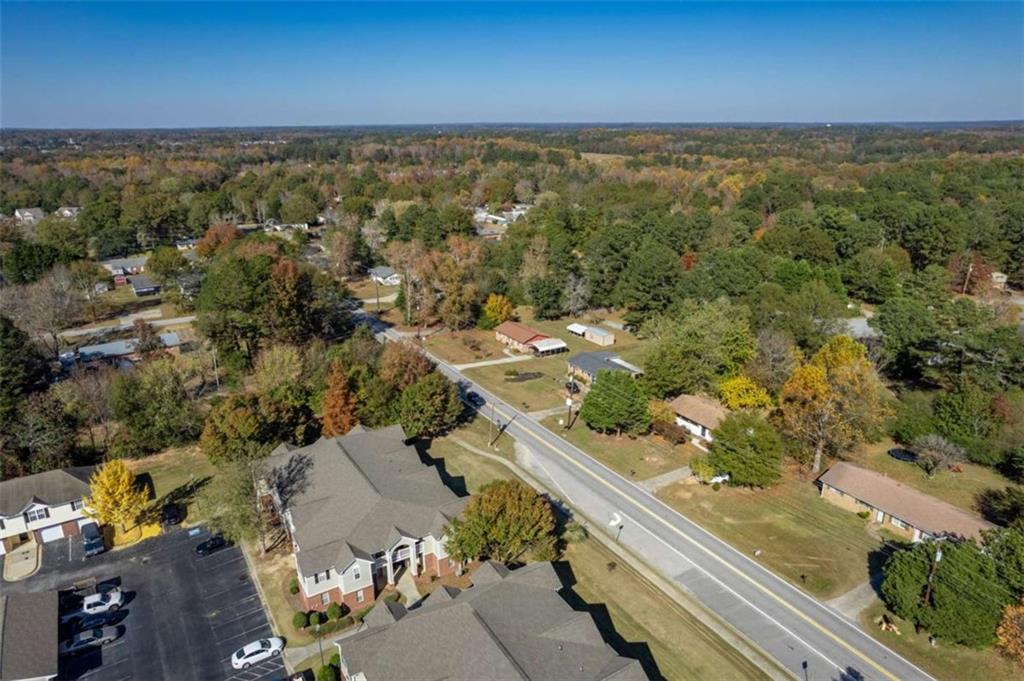 511 Lee Byrd Road Loganville, GA 30052 - Photo 31 of 32 an aerial view of residential houses with outdoor space